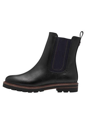 Botte de cheville en cuir noir avec un bout arrondi, panneau latéral élastique en violet foncé et une semelle épaisse et robuste avec un léger talon.