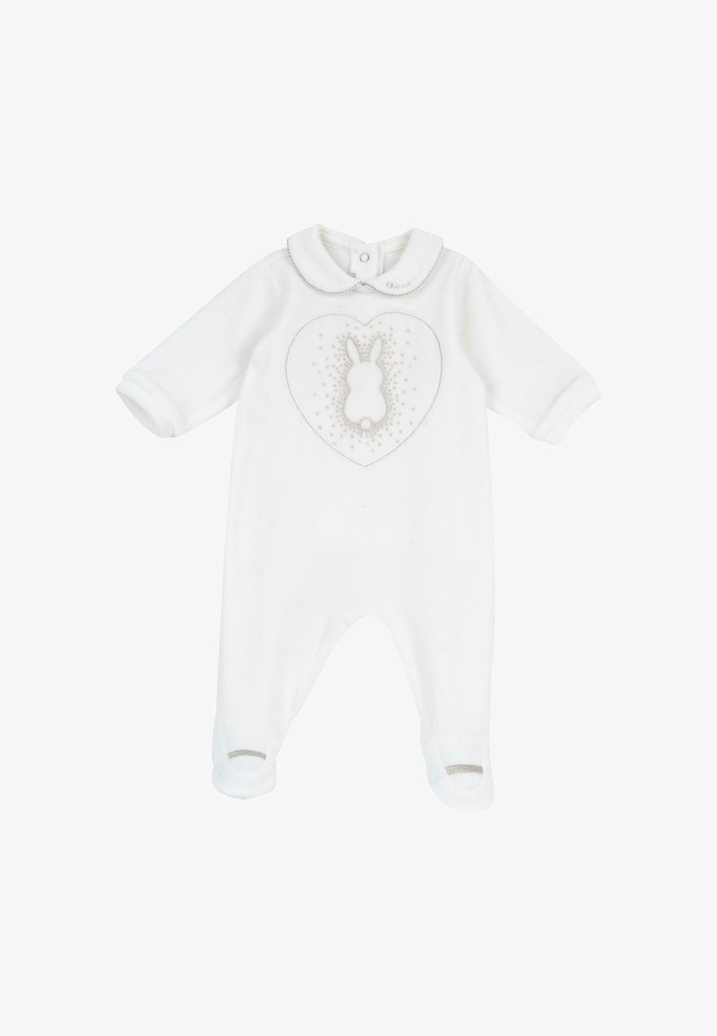 Grenouillère blanche à manches longues avec pieds, col peter pan et motif lapin en forme de cœur avec des étoiles sur la poitrine.