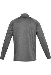 Langärmliges Sportshirt aus dunkelgrauem Stoff, mit hohem Kragen und Raglanärmeln, minimalen Nähten und glatter Textur.