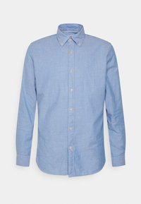 Ljusblå långärmad skjorta med knappar och spetsig krage, guldknappar, rundad nederkant och en texturerad tyg.