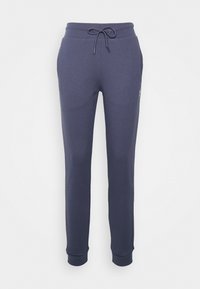 Granatowe dresy wykonane z miękkiej mieszanki bawełny, z elastycznym paskiem na sznurku, bocznymi kieszeniami i ściągaczami na mankietach. Minimalistyczny design z detalem logo.