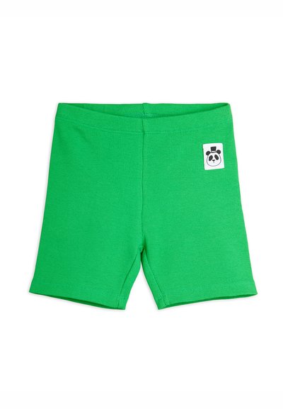 Shorts vert vif côtelés avec ceinture élastique et petite étiquette blanche sur le devant arborant un visage de panda portant un chapeau.