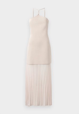 Sleeveless dress with a fitted top in soft beige fabric, featuring a pleated skirt in a lighter shade and adjustable twisted straps.