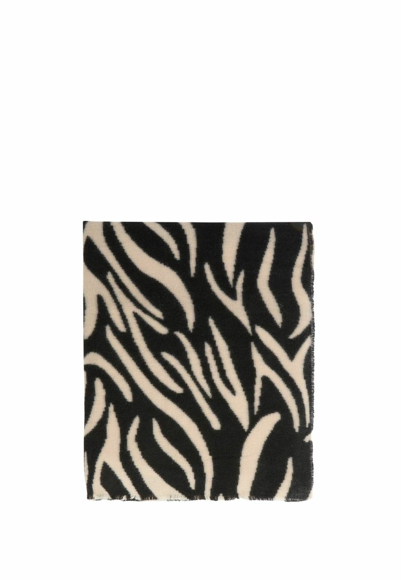 Coperta nera e crema con un audace motivo astratto a zebra. Tessuto morbido con bordi frangiati. Forma quadrata.