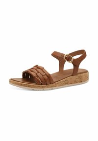 Brune lædersandal med vævede frontremme, kork-platformsål, justerbar ankelrem med en guldbuckle og tekstureret bund.