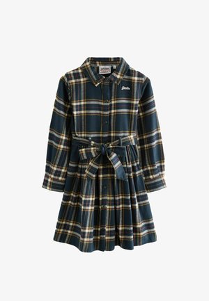 Abito in flanella di colore blu scuro con un motivo a quadri gialli, rossi e bianchi. Presenta una chiusura frontale con bottoni, colletto e una cintura con nodo in vita.