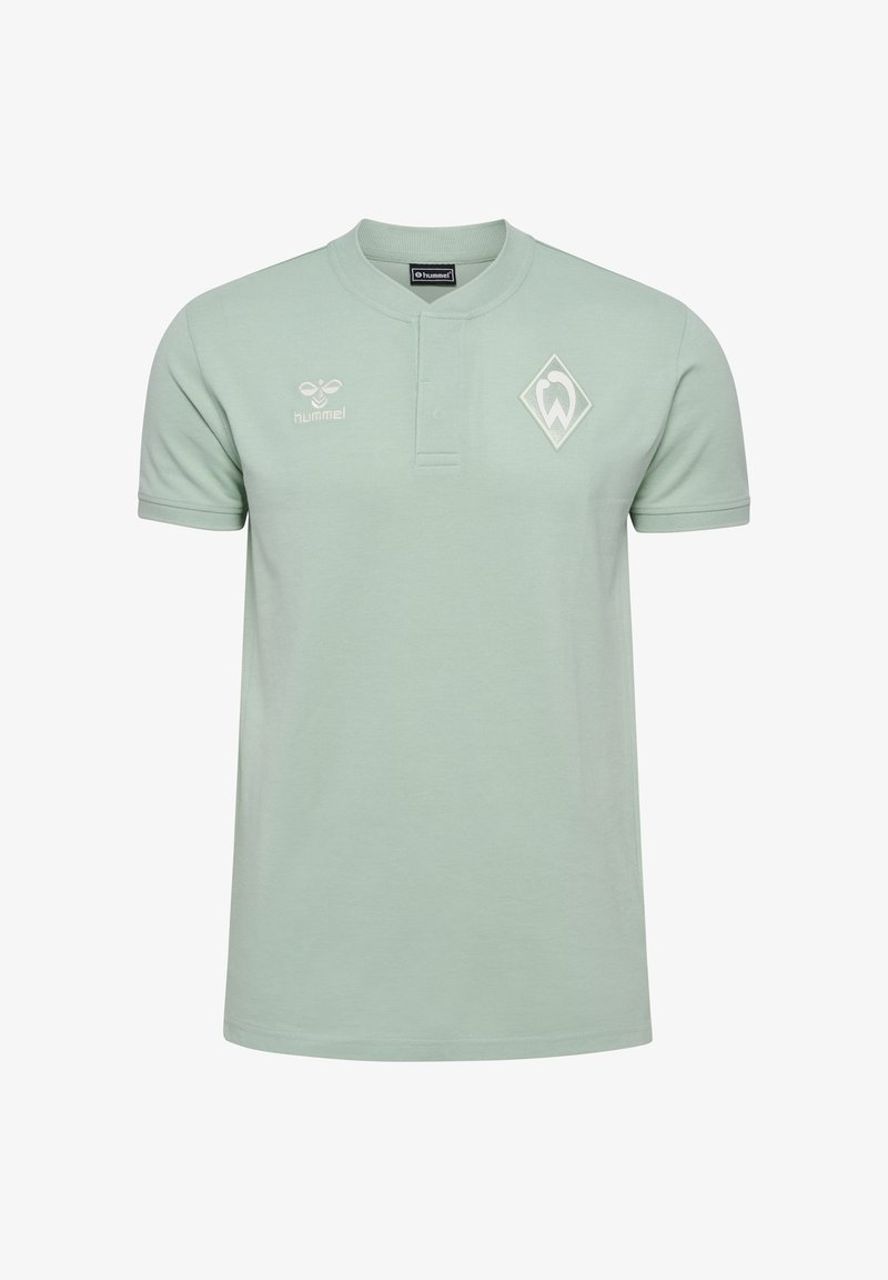 Jasnozielona koszulka polo, krótki rękaw, z zapięciem na guziki oraz diamentowym logo na piersi. Wykonana z gładkiego materiału o swobodnym kroju.