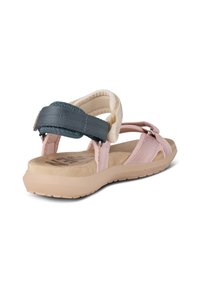 Sandals with a beige base and pink straps, featuring a dark blue back strap, soft footbed, and textured detailing on straps.