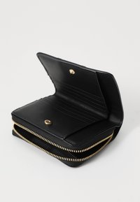 Black leather wallet with gold zipper, featuring multiple card slots and a snap closure. Textured exterior with smooth inner lining.