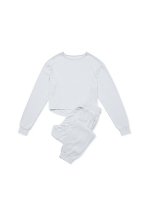 Jasnoszary, prążkowany zestaw dresowy składający się z długiego rękawa topu typu crop z okrągłym dekoltem oraz dopasowanych spodni z elastycznym paskiem i ściągaczami.