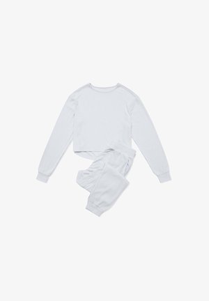 Jasnoszary, prążkowany zestaw dresowy składający się z długiego rękawa topu typu crop z okrągłym dekoltem oraz dopasowanych spodni z elastycznym paskiem i ściągaczami.