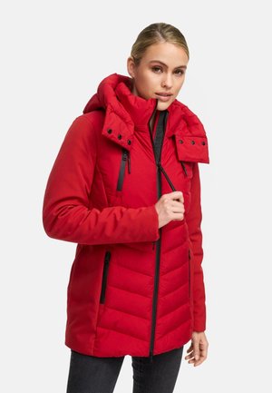 Red puffer jacket with a high collar and detachable hood. Features a zipper front, two zippered pockets, and chevron quilted texture.