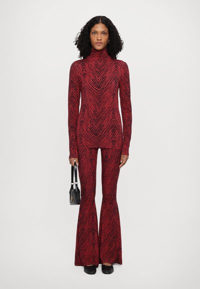 Stieglitz MISO FLARED LEGGINGS - Leggings - Trousers - red