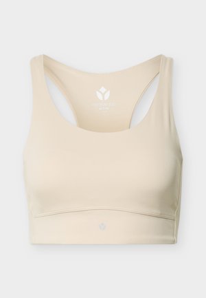 Béžová športová podprsenka s prekríženými ramienkami, výstrihom do U a bezšvovým dizajnom, označená „Even&Odd Active“ v veľkosti malá.