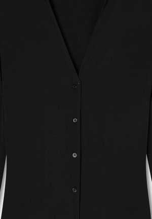 Cardigan nero a maniche lunghe con scollo a V e cinque bottoni frontali, realizzato in tessuto morbido e leggero.