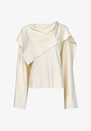 Suéter crema asimétrico hecho de una tela suave, con escote drapeado y mangas largas de corte holgado. Diseño minimalista.