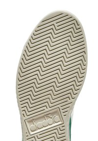 Suola di sneaker bianca con motivo a zigzag, dotata di un logo rettangolare; texture liscia e bordi arrotondati.