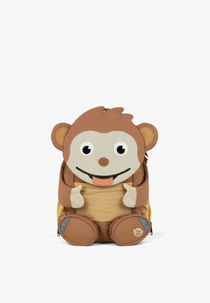 Child-sized backpack shaped like a monkey, featuring a soft brown exterior, large eyes, and textured ears, with zippered compartments and accents.