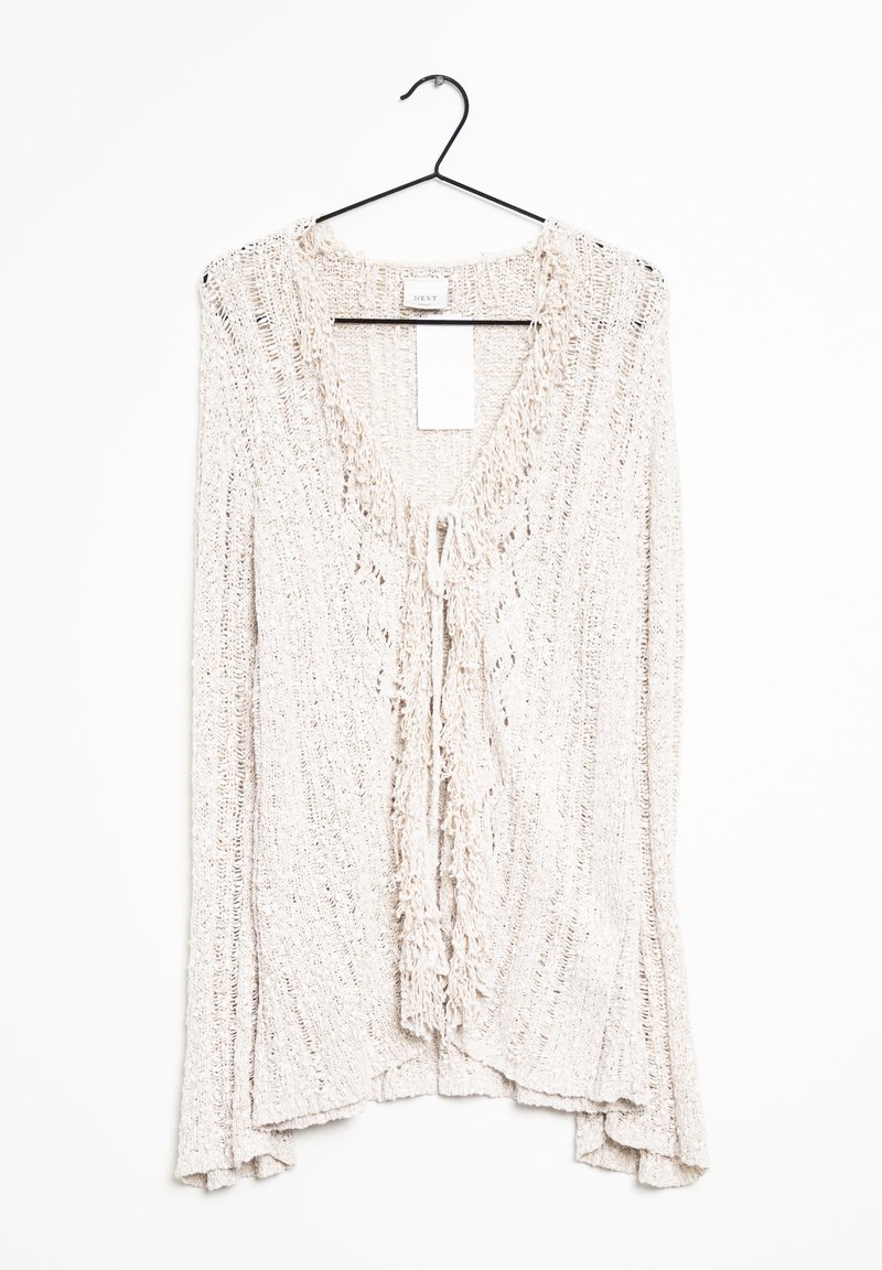Knit cardigan in light beige with a textured, open weave. Features a V-neck and tie closure at the front, with fringed edges at sleeves.