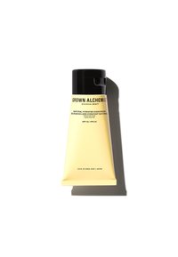 Grown Alchemist naturlig återfuktande solkräm i en gul tub, med svart lock och text som anger SPF 30, 150 ml storlek och produktinformation.