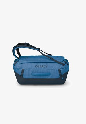 Duffle bag in blue with a grid pattern, featuring dark blue accents and adjustable straps, made from durable fabric, and has a side handle.