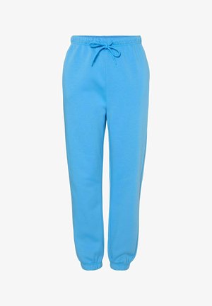 Gaiši zili sporta bikses, kas izgatavotas no mīksta auduma, ar elastīgu jostu un auklu, kā arī sašaurinātiem piedurknēm pie potītēm.