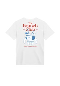 White cotton t-shirt featuring graphic of a smiling cup holding waffles, with "The Brunch Club" and "JOIN THE CLUB. BRING WAFFLES." printed in red.