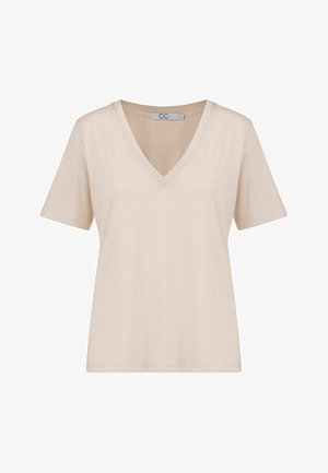 Beige katoenen T-shirt met een V-hals, korte mouwen en een losse pasvorm. Glad oppervlak en minimalistisch ontwerp. Label zichtbaar bij de halslijn.
