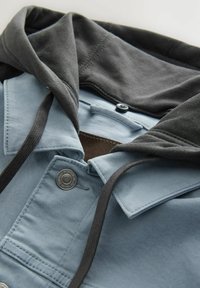 Blue and gray zip-up hooded jacket featuring a button closure, drawstrings, and contrasting fabric textures at the collar and hood.