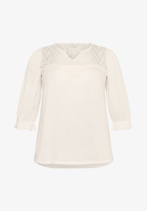 Witte blouse met lange, geraffineerde mouwen, voorzien van een textuurkant paneel bij de schouderpas en een ronde halslijn. Zachte katoen.