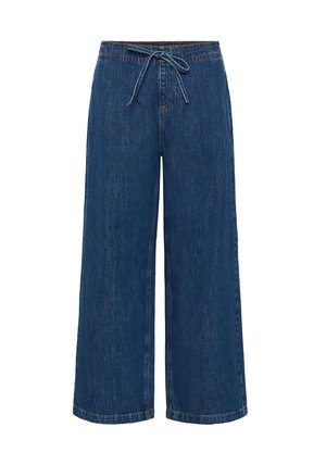 Pantalon en jean à jambes larges de couleur bleu foncé. Texture douce avec une taille à cordon de serrage et des coutures visibles. Coupe décontractée et relax.