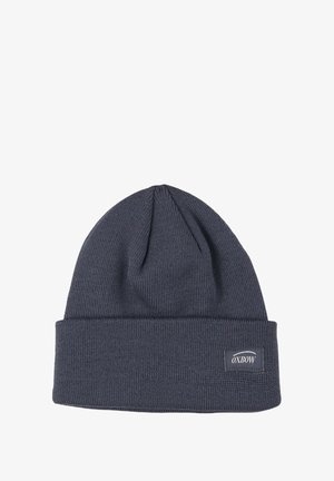 Bonnet tricoté en marine avec un revers, fabriqué à partir de matériau texturé. Présente une petite étiquette logo rectangulaire sur le côté.