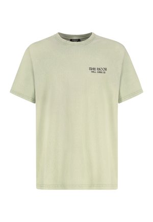 Hellgrünes Baumwoll-T-Shirt mit kurzen Ärmeln, Rundhalsausschnitt und einem kleinen schwarzen grafischen Text auf der Vorderseite. Glatte Textur, lockere Passform.