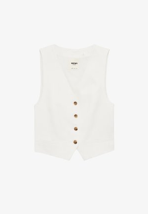 Veste blanche sans manches avec col en V et quatre boutons bruns sur le devant, comportant deux poches avant et un ourlet légèrement pointu.