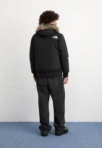 The North Face MCMURDO  - Jachetă cu puf - black