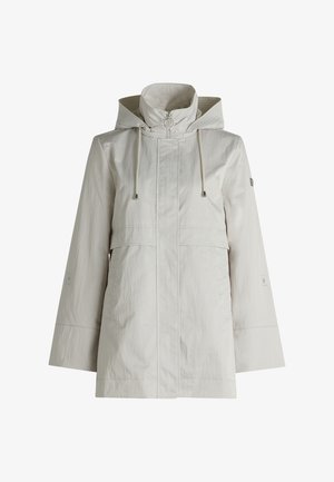 Veste de pluie beige légère avec capuche, cordon de serrage, fermeture éclair frontale, grandes poches et tissu texturé pour la résistance à l'eau.