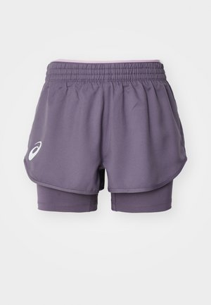 Purple athletic shorts with elastic waistband, featuring a layered design and integrated inner shorts. Logo on the lower left leg.