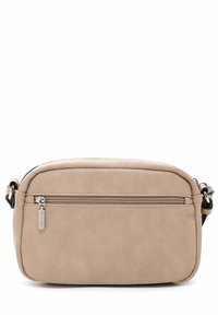 Beež ristkülikukujuline õlakott, esiküljel tõmblukuga tasku, hõbedane tõmbluku tõmbeosa ja reguleeritavad rihma kinnitused valgel taustal.