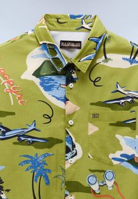 Green button-up shirt with blue palm trees, airplanes, binoculars, a car, and "Napapijri" text patterns, featuring a chest pocket and collar.
