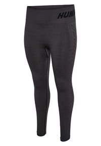 Svarta leggings med bred midjeband, strukturerade sidpaneler och ett zickzackmönster. Tillverkade av stretchigt material för aktiv träning.