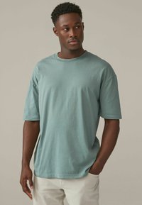 Next RELAXED FIT zielony