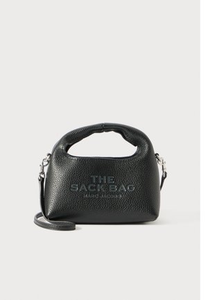 Black textured leather handbag with top handle and detachable strap, featuring embossed text "THE SACK BAG MARC JACOBS" on front.