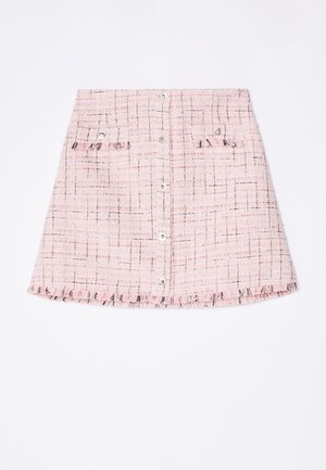 Pink tweed mini skirt with a textured finish, featuring two front pockets, a frayed hem, and metallic button closures.