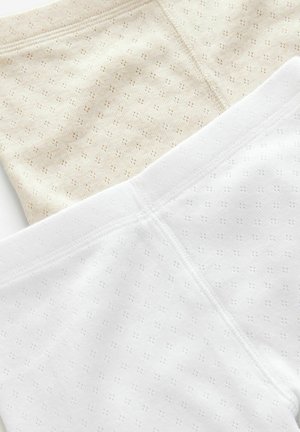 Pantaloni corti in misto cotone beige e bianchi, con un motivo testurizzato di piccoli fori. Vita elastica e cuciture piatte per il massimo comfort.