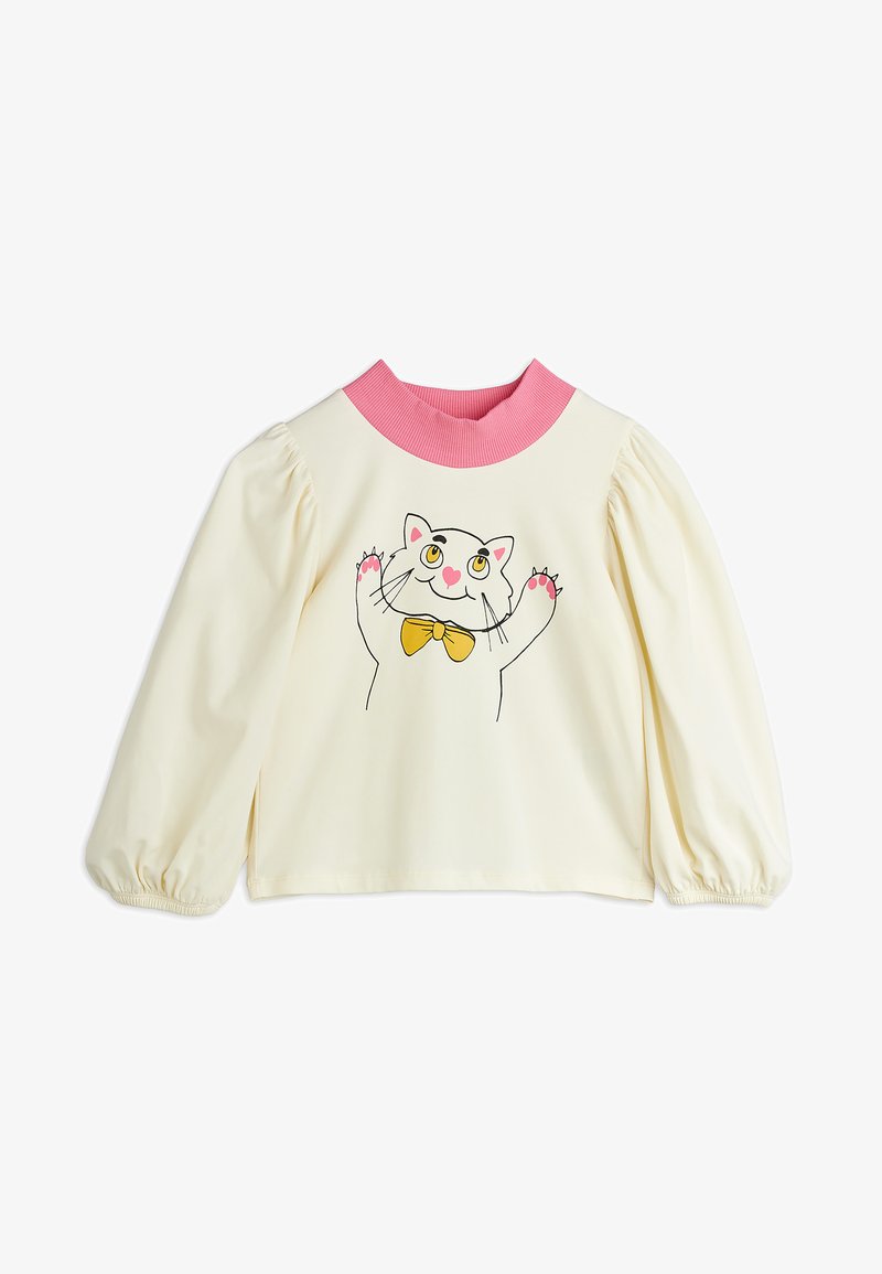 Krém színű, hosszú ujjú ing, puffadt ujjak, rózsaszín bordás gallérral, és egy sárga csokornyakkendőt viselő fehér macska rajzával elől.