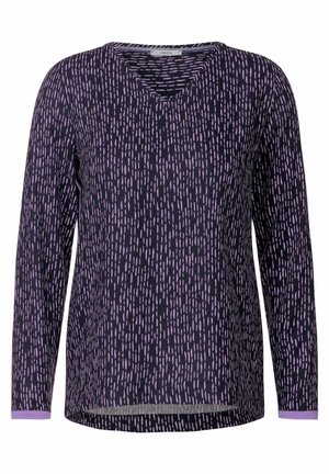 Langarmshirt mit tiefem V-Ausschnitt, aus dunkelpurpurfarbenem Stoff mit einem verstreuten hellpurpurfarbenen Muster. Weicher Stoff mit kontrastierenden Bündchen.