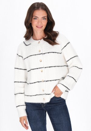 White knitted cardigan with black horizontal stripes, round neckline, and wooden buttons down the front. Soft texture, relaxed fit.