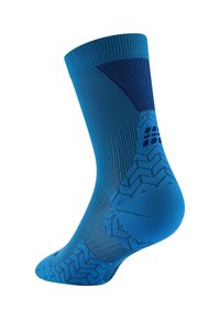 Calza sportiva blu con bordo a costine, tessitura decorata e impugnatura testurizzata sul tallone e sulla punta per una maggiore aderenza.