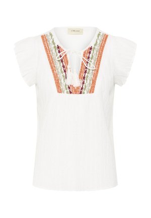 Blouse blanche à manches courtes avec tissu texturé, col en V avec cordon à pompons, et broderie florale multicolore en orange, vert et bordeaux sur le devant.