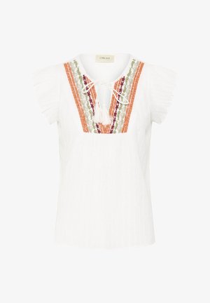 Blouse blanche à manches courtes avec tissu texturé, col en V avec cordon à pompons, et broderie florale multicolore en orange, vert et bordeaux sur le devant.